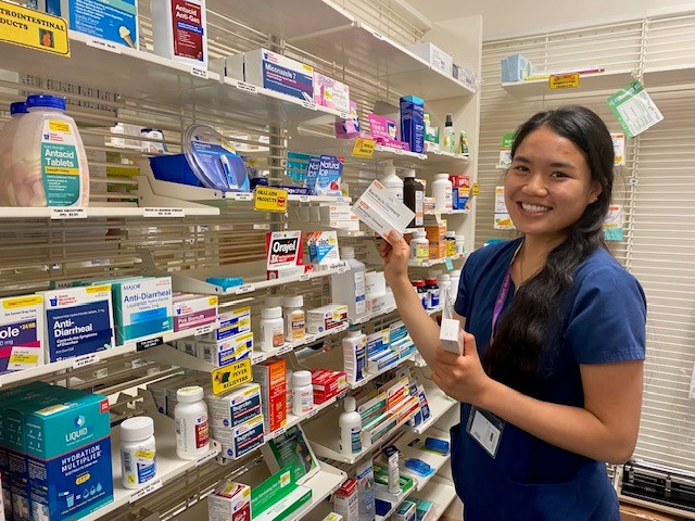 Pharmacy Technician holding medication