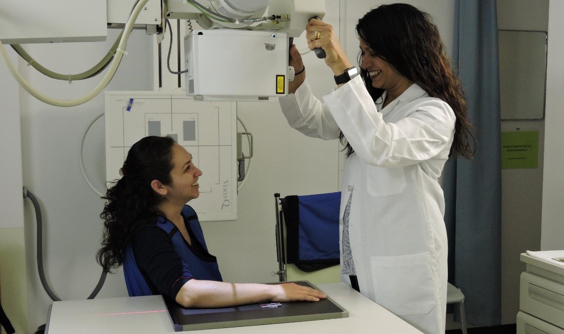 Doctor giving a nurse an xray